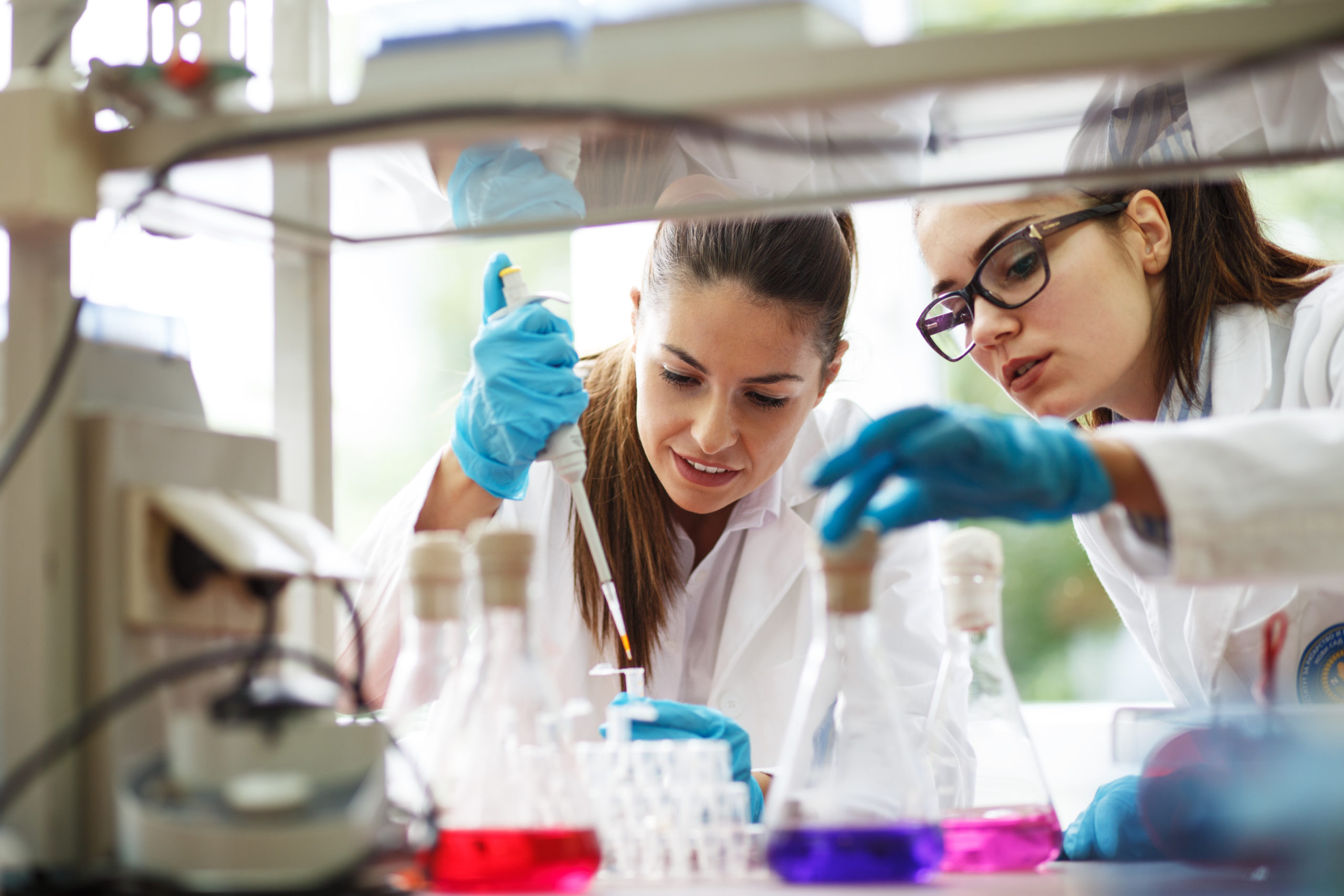 Two,Young,Female,Scientist,Doing,Experiments,In,Lab.