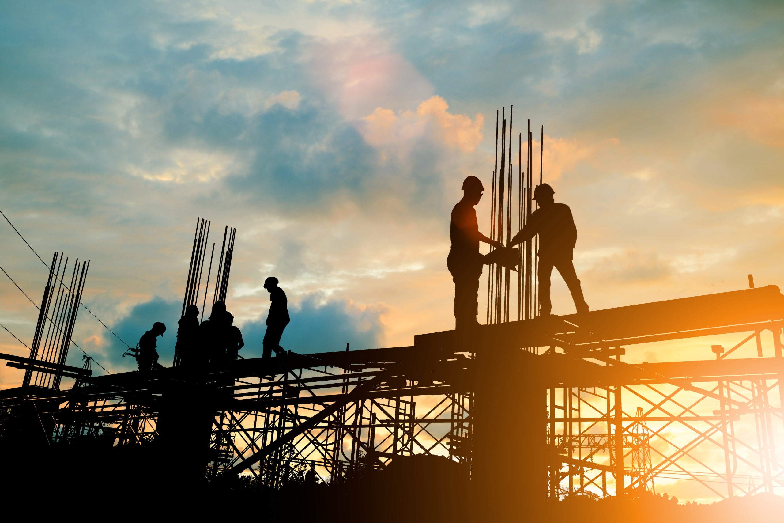 Silhouette,Of,Engineer,And,Construction,Team,Working,At,Site,Over